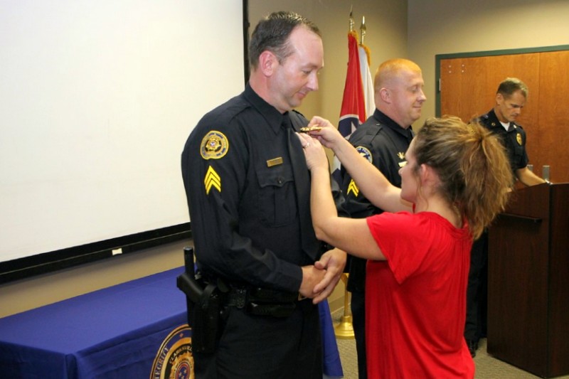 Sgt Greg Beebe being pinned by his spouse, Angela. (Photo by CPD-Jim Knoll) Sgt Greg Beebe being pinned by his spouse, Angela. (Photo by CPD-Jim Knoll)