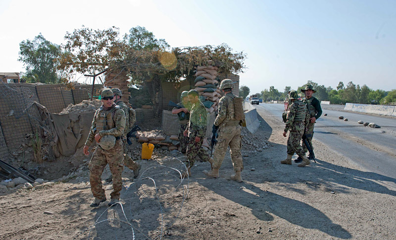 U.S. Army Soldiers from Security Forces Advisory and Assistance Team Archangel, 1st Brigade Combat Team, 101st Airborne Division, and Afghan National Army soldiers approach a security checkpoint on Highway 7 in Bati Kot district, Nangarhar Province, Afghanistan, June 15, 2013. (U.S. Army photo by Sgt. Margaret Taylor, 129th Mobile Public Affairs Detachment) U.S. Army Soldiers from Security Forces Advisory and Assistance Team Archangel, 1st Brigade Combat Team, 101st Airborne Division, and Afghan National Army soldiers approach a security checkpoint on Highway 7 in Bati Kot district, Nangarhar Province, Afghanistan, June 15, 2013. (U.S. Army photo by Sgt. Margaret Taylor, 129th Mobile Public Affairs Detachment)