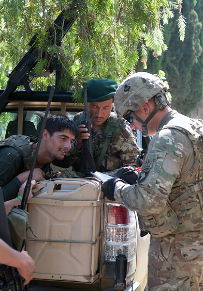 U.S. Army 1st Sgt. Christopher Carey, first sergeant, Security Forces Advisory and Assistance Team Archangel, 1st Brigade Combat Team, 101st Airborne Division, of Springtown, Texas, confers with Afghan National Army soldiers on the outskirts of the village of Takiya Khana, Bati Kot district, Nangarhar Province, Afghanistan, June 15, 2013. (U.S. Army photo by Sgt. Margaret Taylor, 129th Mobile Public Affairs Detachment) U.S. Army 1st Sgt. Christopher Carey, first sergeant, Security Forces Advisory and Assistance Team Archangel, 1st Brigade Combat Team, 101st Airborne Division, of Springtown, Texas, confers with Afghan National Army soldiers on the outskirts of the village of Takiya Khana, Bati Kot district, Nangarhar Province, Afghanistan, June 15, 2013. (U.S. Army photo by Sgt. Margaret Taylor, 129th Mobile Public Affairs Detachment)