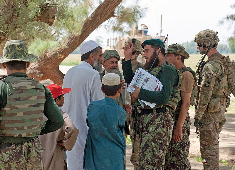 The Afghan National Army cultural, religious and public affairs advisor, 2nd Kandak, 4th Brigade, speaks with elders from the village of Takiya Khana, Bati Kot district, Nangarhar Province, Afghanistan, June 15, 2013. The visit to Takiya Khana was part of an ongoing operation, spearheaded by Afghan National Security Forces, to protect the nearby Highway 7 from enemy activity. (U.S. Army photo by Sgt. Margaret Taylor, 129th Mobile Public Affairs Detachment) The Afghan National Army cultural, religious and public affairs advisor, 2nd Kandak, 4th Brigade, speaks with elders from the village of Takiya Khana, Bati Kot district, Nangarhar Province, Afghanistan, June 15, 2013. The visit to Takiya Khana was part of an ongoing operation, spearheaded by Afghan National Security Forces, to protect the nearby Highway 7 from enemy activity. (U.S. Army photo by Sgt. Margaret Taylor, 129th Mobile Public Affairs Detachment)