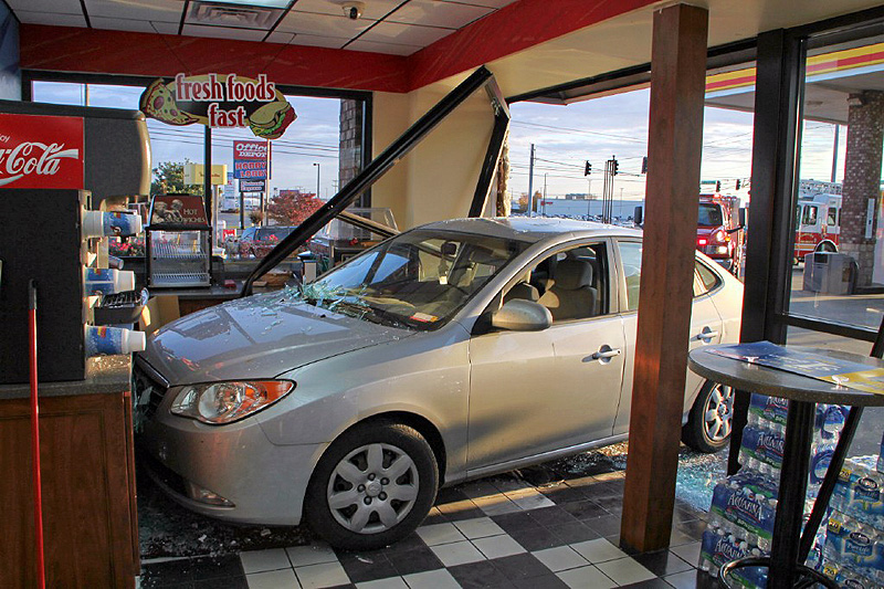 Brakes on the Hyundai Elantra fail and it crashed through the glass of the Shell Sudden Service on Wilma Rudolph Boulevard. (Photo by CPD-Jim Knoll) Brakes on the Hyundai Elantra fail and it crashed through the glass of the Shell Sudden Service on Wilma Rudolph Boulevard. (Photo by CPD-Jim Knoll)