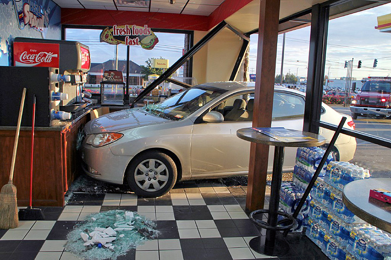 Brakes on the Hyundai Elantra fail and it crashed through the glass of the Shell Sudden Service on Wilma Rudolph Boulevard. (Photo by CPD-Jim Knoll) Brakes on the Hyundai Elantra fail and it crashed through the glass of the Shell Sudden Service on Wilma Rudolph Boulevard. (Photo by CPD-Jim Knoll)