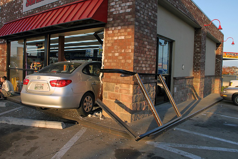 Brakes on the Hyundai Elantra fail and it crashed through the glass of the Shell Sudden Service on Wilma Rudolph Boulevard. (Photo by CPD-Jim Knoll) Brakes on the Hyundai Elantra fail and it crashed through the glass of the Shell Sudden Service on Wilma Rudolph Boulevard. (Photo by CPD-Jim Knoll)