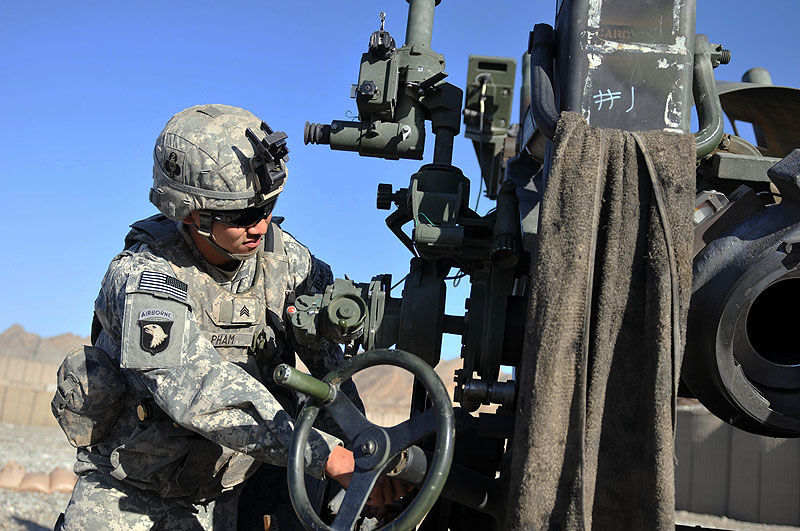 U.S. Army Sgt. Khoi M. Pham of Baltimore, a gunner with 3rd Section, 1st Platoon, Battery A, 2nd Battalion, 320th Field Artillery Regiment, Task Force Balls, elevates a M777 howitzer moments before it is fired from Combat Outpost Garcia in eastern Afghanistan’s Nangarhar Province Oct. 2nd. (Photo by U.S. Army Sgt. Albert L. Kelley, 300th Mobile Public Affairs Detachment) U.S. Army Sgt. Khoi M. Pham of Baltimore, a gunner with 3rd Section, 1st Platoon, Battery A, 2nd Battalion, 320th Field Artillery Regiment, Task Force Balls, elevates a M777 howitzer moments before it is fired from Combat Outpost Garcia in eastern Afghanistan’s Nangarhar Province Oct. 2nd. (Photo by U.S. Army Sgt. Albert L. Kelley, 300th Mobile Public Affairs Detachment)