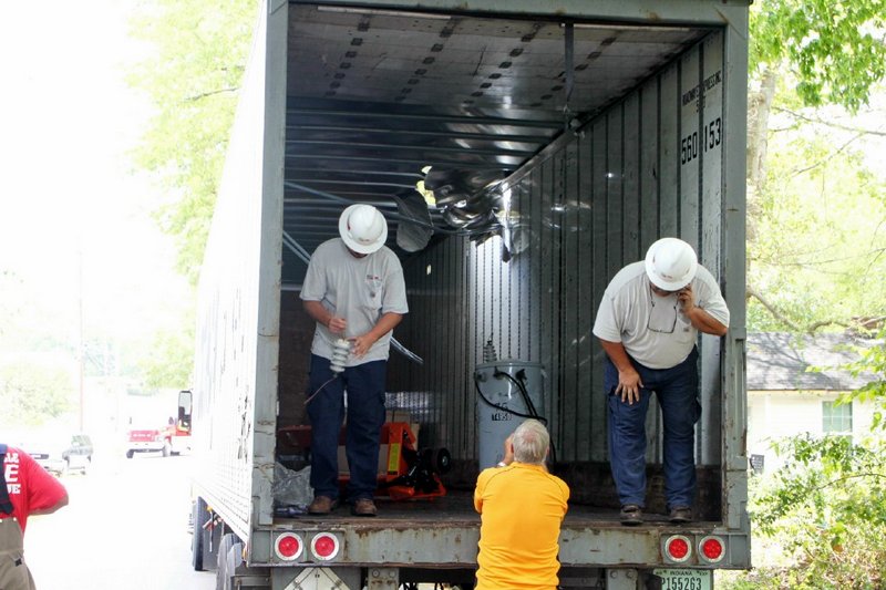 Transformer falls through roof of Tractor Trailer when utility pole is hit. (Photo by CPD-Jim Knoll) Transformer falls through roof of Tractor Trailer when utility pole is hit. (Photo by CPD-Jim Knoll)
