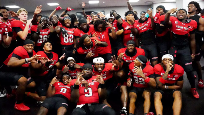 Austin Peay State University football players celebrate on the sideline during the Govs' record-breaking 35-point second quarter against Morehead State on Saturday at Fortera Stadium. (APSU Sports Information)