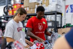 Austin Peay volunteers sorting clothing donations at the YAIPAK Warehouse