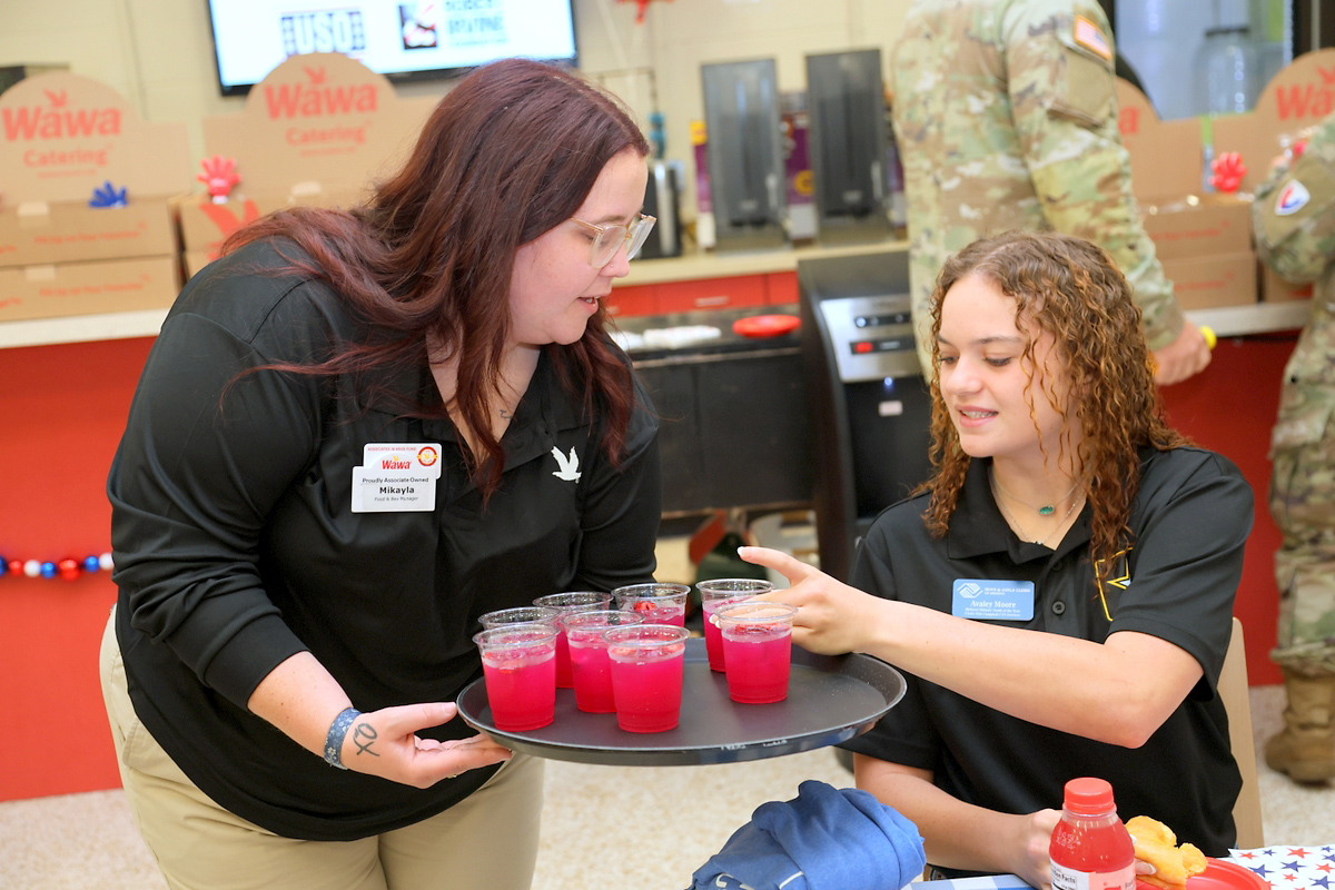 Mikayla Applewhite serving Avaley Moore a dragonfruit refresher at Wawa's USO event at Fort Campbell Mikayla Applewhite serving Avaley Moore a dragonfruit refresher at Wawa's USO event at Fort Campbell